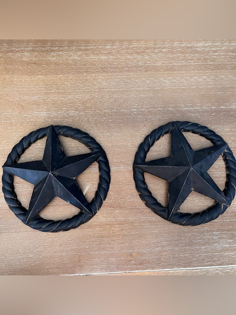 A pair of cast iron Texas star wall plaques
